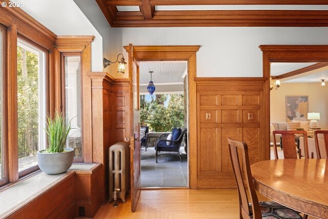 1314 SE 55th Ave, Portland, OR 97215 - dining room with radiator, healthy amount of natural light, beam ceiling, light wood-style flooring, and ornamental molding