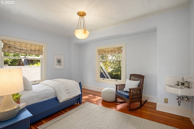 1314 SE 55th Ave, Portland, OR 97215 - bedroom featuring ornamental molding, wood finished floors, and baseboards
