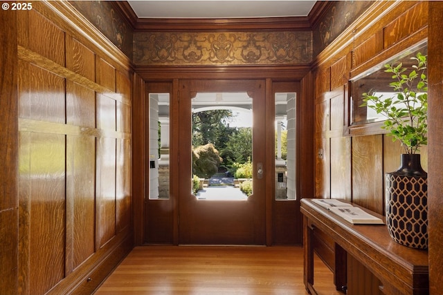 1314 SE 55th Ave, Portland, OR 97215 - foyer with ornamental molding, light wood-style floors, and wood walls