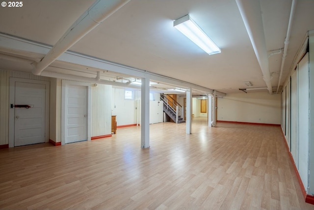 1314 SE 55th Ave, Portland, OR 97215 - finished basement with light wood-style floors, stairs, and baseboards