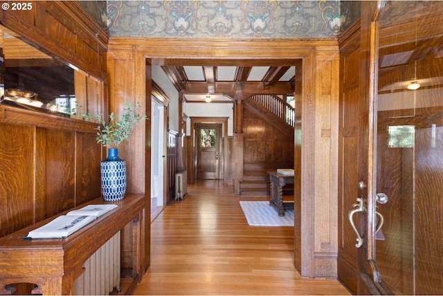 1314 SE 55th Ave, Portland, OR 97215 - foyer featuring radiator, wooden walls, and light wood-type flooring