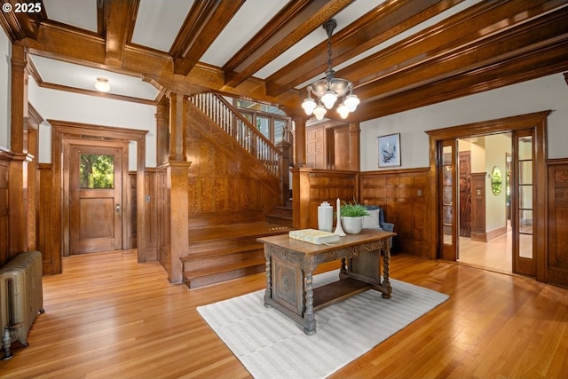 1314 SE 55th Ave, Portland, OR 97215 - office space featuring radiator heating unit, a chandelier, beam ceiling, light wood finished floors, and wood walls