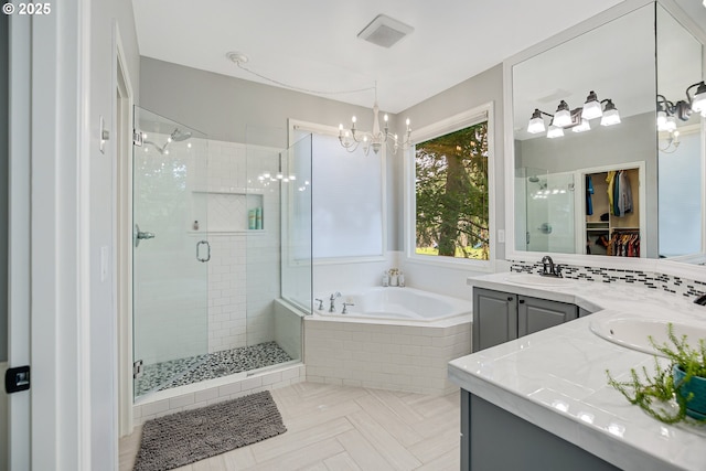11942 SE Sunny Way, Happy Valley, OR 97086 - full bath with vanity, a stall shower, a chandelier, a garden tub, and a spacious closet