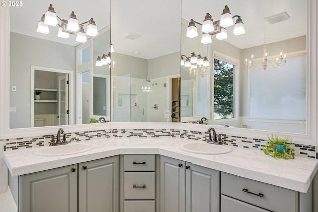 11942 SE Sunny Way, Happy Valley, OR 97086 - full bathroom with backsplash, double vanity, a stall shower, toilet, and a chandelier
