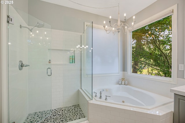 11942 SE Sunny Way, Happy Valley, OR 97086 - bathroom featuring a shower stall, a tub with jets, vanity, and a chandelier