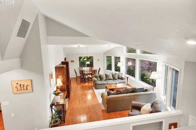 2002 Kimberly Dr, Eugene, OR 97405 - living room with healthy amount of natural light, wood finished floors, and high vaulted ceiling
