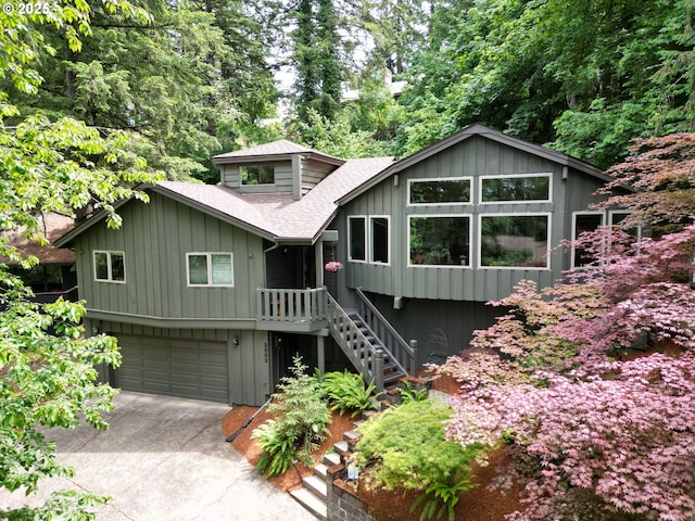2002 Kimberly Dr, Eugene, OR 97405 - view of front facade with a shingled roof, an attached garage, and concrete driveway