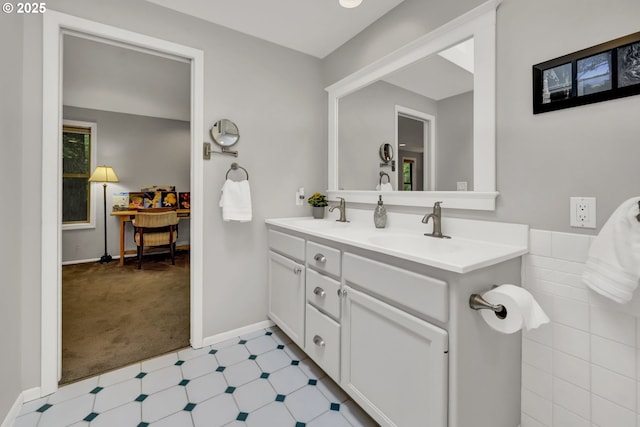 2002 Kimberly Dr, Eugene, OR 97405 - full bathroom with double vanity, tile patterned floors, and baseboards
