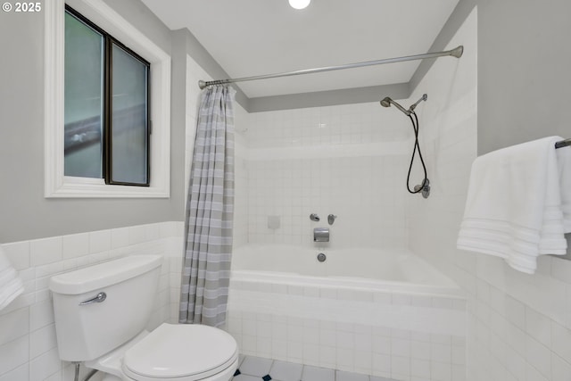 2002 Kimberly Dr, Eugene, OR 97405 - full bathroom featuring tiled shower / bath combo, toilet, tile walls, and wainscoting