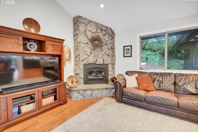 2002 Kimberly Dr, Eugene, OR 97405 - living room featuring vaulted ceiling, light wood-style floors, and a stone fireplace