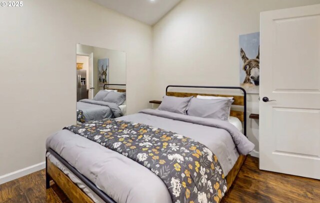 23218 E Homer Ave, Welches, OR 97067 - bedroom with wood finished floors, stainless steel fridge, and baseboards