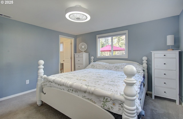 carpeted bedroom with baseboards and visible vents