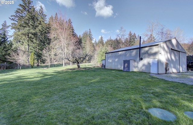 view of yard featuring an outbuilding and a pole building