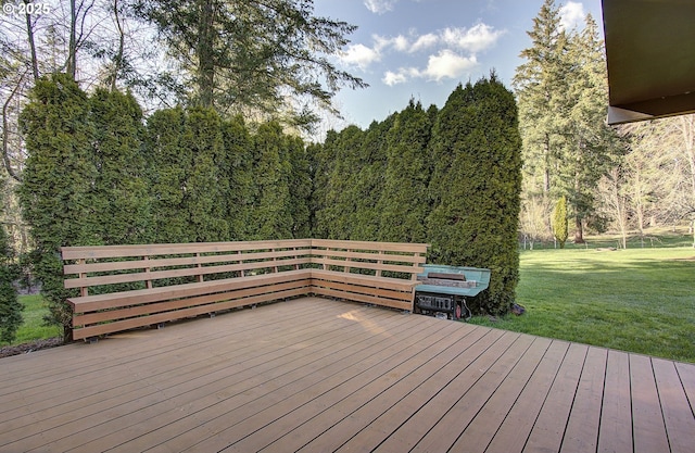 wooden deck with a lawn