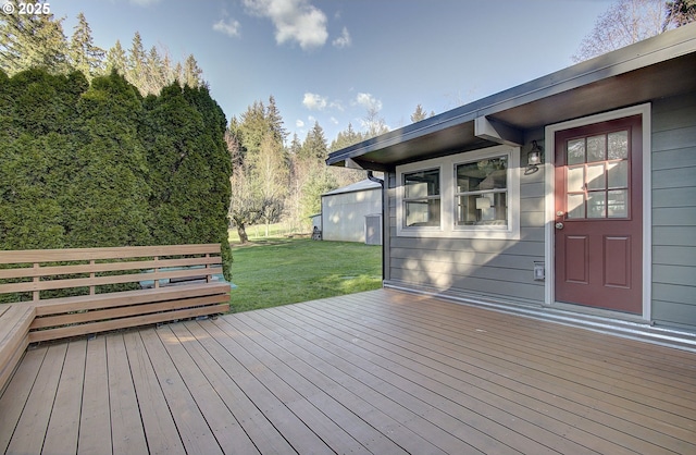 wooden deck with a lawn