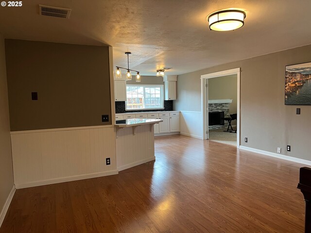 empty room with dark hardwood / wood-style floors