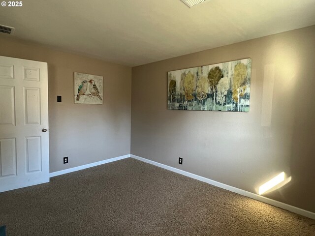 unfurnished room featuring carpet floors