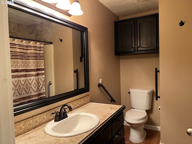 doorway to outside featuring hardwood / wood-style flooring and a textured ceiling