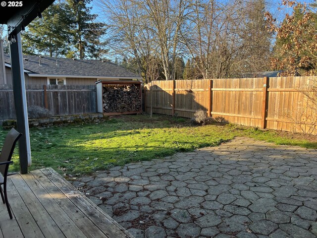 back of property with a patio area and a lawn