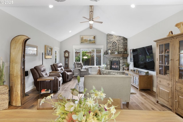 3461 Sterling Woods Dr, Eugene, OR 97408 - living room featuring a ceiling fan, a stone fireplace, and light wood finished floors