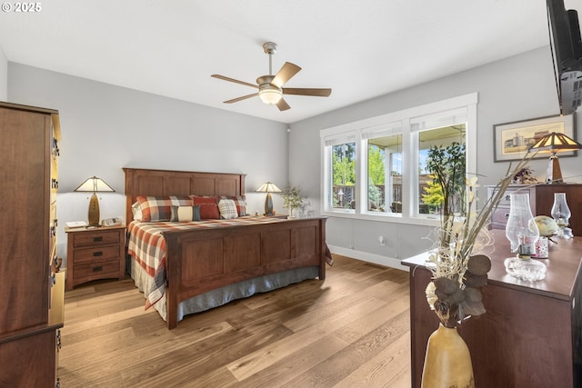 3461 Sterling Woods Dr, Eugene, OR 97408 - bedroom with light wood finished floors and ceiling fan