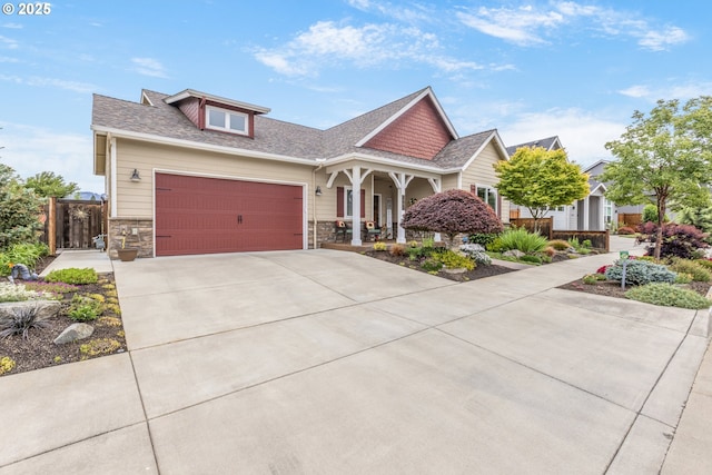 3461 Sterling Woods Dr, Eugene, OR 97408 - craftsman-style house with driveway, covered porch, an attached garage, and stone siding