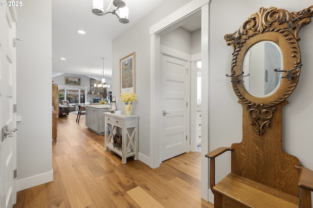 3461 Sterling Woods Dr, Eugene, OR 97408 - hall with a chandelier, light wood-style flooring, recessed lighting, and vaulted ceiling