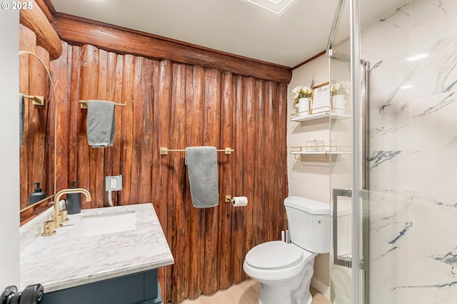 bathroom with an enclosed shower, vanity, and toilet