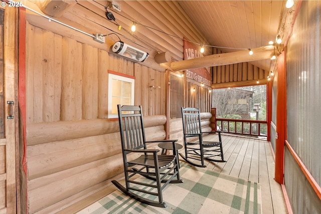 wooden terrace with a porch