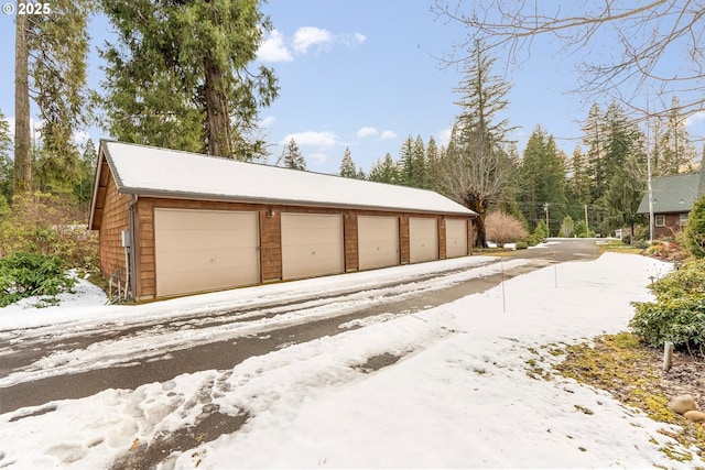 view of snow covered garage