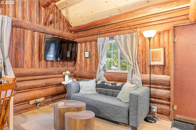 living area with wood ceiling, vaulted ceiling, and light hardwood / wood-style floors