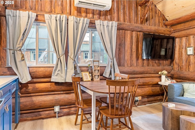 sitting room with lofted ceiling, a wall unit AC, rustic walls, wood ceiling, and light wood-type flooring