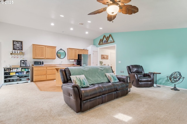 living area featuring light carpet, recessed lighting, ceiling fan, and vaulted ceiling