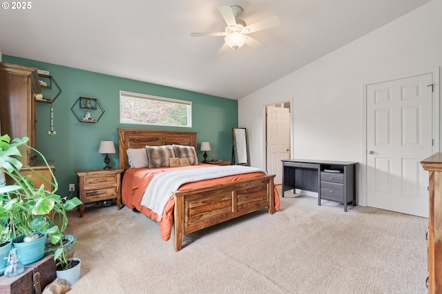 bedroom with lofted ceiling, light colored carpet, and ceiling fan