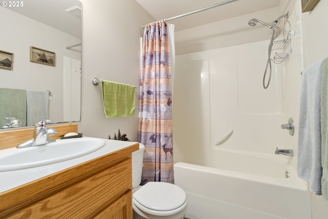 full bath featuring vanity, toilet, visible vents, and shower / tub combo with curtain