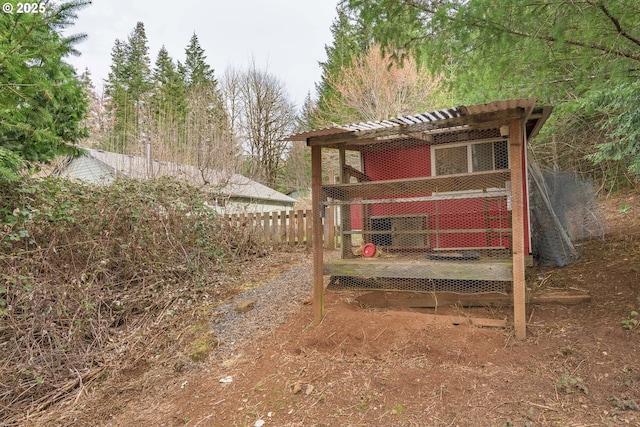 view of yard featuring an outbuilding and exterior structure