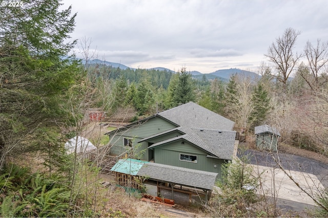 bird's eye view with a mountain view and a forest view