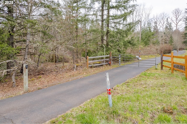 view of street featuring a gate