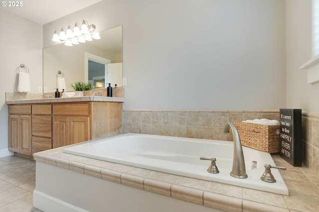 full bathroom with tile patterned flooring, vanity, and a garden tub