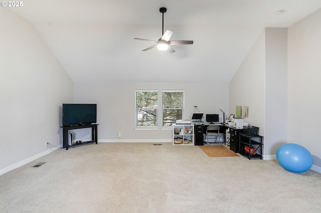 carpeted office space with baseboards, vaulted ceiling, a ceiling fan, and visible vents