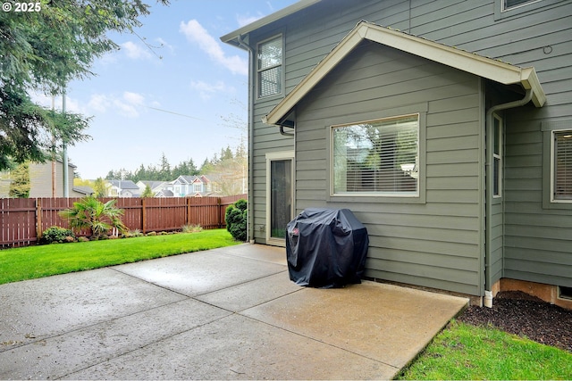 exterior space featuring a yard, a patio area, and fence