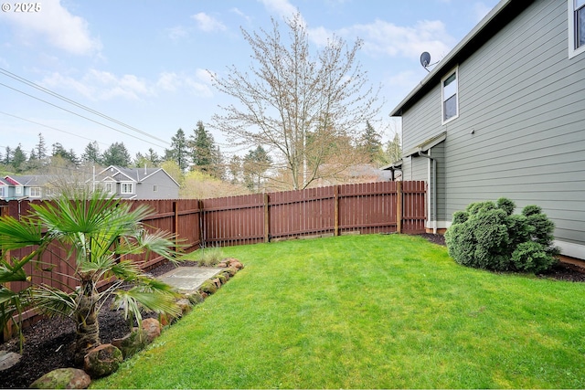 view of yard featuring a fenced backyard