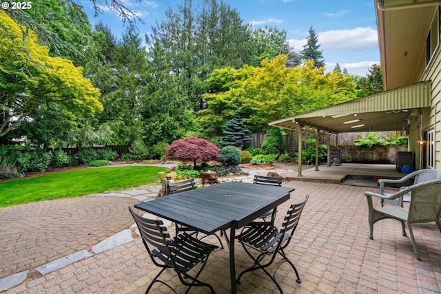 9004 SW 36th Ave, Portland, OR 97219 - fenced backyard with a patio, outdoor dining space, and view of scattered trees