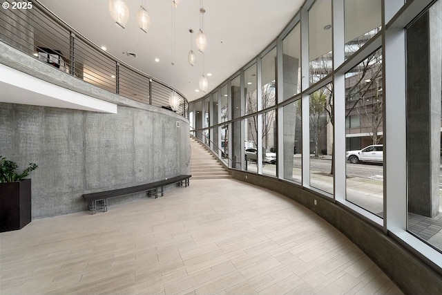 interior space featuring a towering ceiling