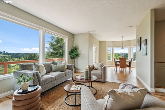 15745 SE Bybee Dr, Portland, OR 97236 - living room featuring light wood-style flooring and baseboards