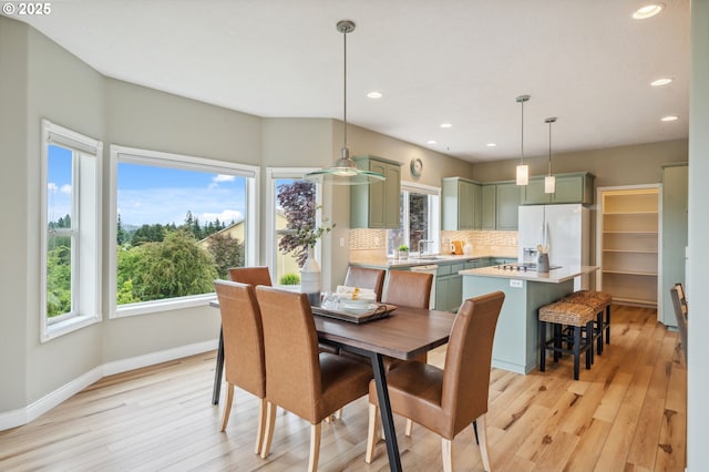 15745 SE Bybee Dr, Portland, OR 97236 - dining area with recessed lighting, light wood-type flooring, and baseboards