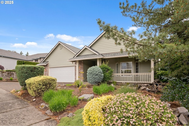 15745 SE Bybee Dr, Portland, OR 97236 - view of front of property featuring covered porch and a garage