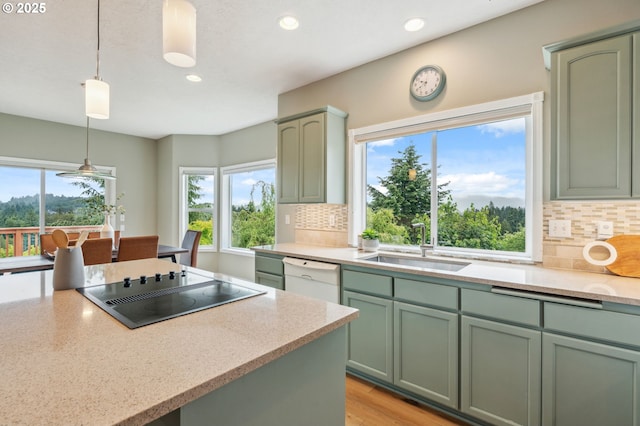 15745 SE Bybee Dr, Portland, OR 97236 - kitchen featuring green cabinets, dishwasher, black electric cooktop, recessed lighting, and a sink