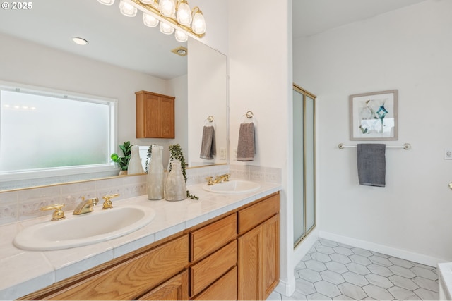 15745 SE Bybee Dr, Portland, OR 97236 - bathroom with double vanity, a shower stall, and baseboards