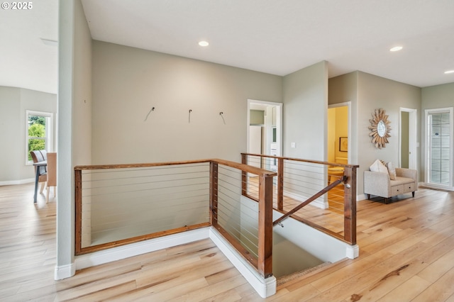 15745 SE Bybee Dr, Portland, OR 97236 - corridor featuring an upstairs landing, wood finished floors, baseboards, and recessed lighting